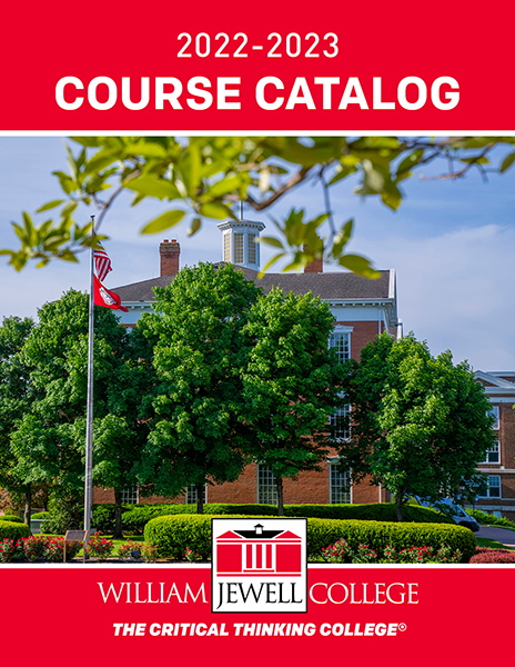 campus building with flagpole